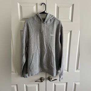 Grey Nike sweatshirt.